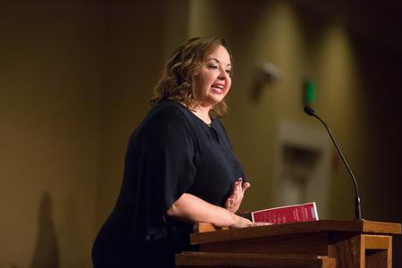 Allison Davis ('12) accepts the Outstanding Young Alumna award during the Meritorious Service Awards Banquet on homecoming weekend.  - Photo by Kristi McMurry Woody