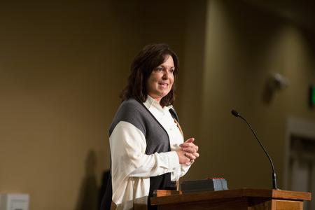 Robyn Hari ('86) accepts the Distinguished Achievement Award in Business during the Meritorious Service Awards Banquet. - Photo by Kristi McMurry Woody