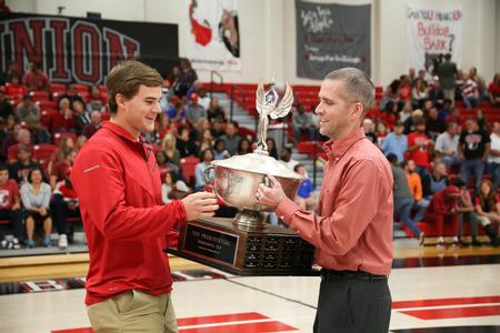 Jason Castles (right), director for student leadership and engagement, presents Austin Orr with the President's Cup, which was awarded to the fraternity of Lambda Chi Alpha. - Photo by Kristi McMurry Woody