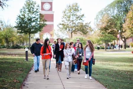 Morgan Morfe, senior social work major and student ambassador, leads Day at the U guests on a tour of campus.  - Photo by Kristi McMurry Woody