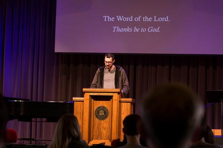 Joshua Stucky, senior mathematics major, leads a responsive reading during chapel. - Photo by Morgan Morfe