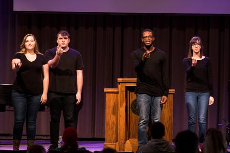 Union University students perform "Amazing Grace" in sign language during chapel.  - Photo by Morgan Morfe
