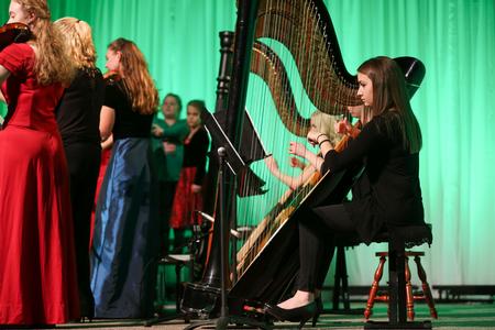 Gretchen Foels, junior music major, plays harp during A Union Christmas in the chapel. - Photo by Kristi McMurry Woody