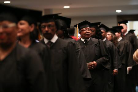 Graduates process into West Jackson Baptist Church during fall commencement.  - Photo by Kristi McMurry Woody