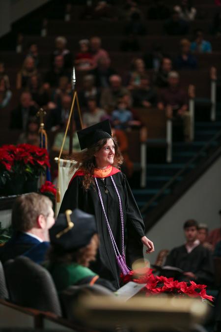 Maria Antoinette Whitcomb, MSN graduate, walks across the stage to receive her diploma during fall commencement. - Photo by Kristi McMurry Woody