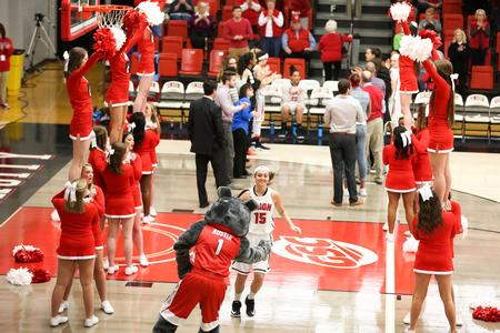 Chelsea Bodiford high-fives Buster the Bulldog at the beginning of the Lady Bulldogs' games against West Georgia.  - Photo by Kristi McMurry Woody