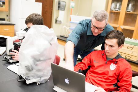 Marc Lockett, associate professor of biology, helps a student with some classwork during histology lab. - Photo by Kristi McMurry Woody