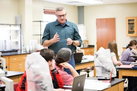 Marc Lockett, associate professor of biology, answers questions during histology lab. - Photo by Kristi McMurry Woody