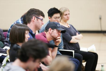 Art students listen as Jack Troy tells stories about working as a potter during the spring art workshop. - Photo by Kristi McMurry Woody