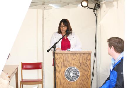 Erin Mount, alumae, reads from the Bible during the Ref500 scripture reading marathon. - Photo by Kristi McMurry Woody