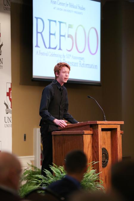 Samuel Edgren, senior theater major, performs a dramatic monologue during the Reformation 500 Festival.  - Photo by Kristi McMurry Woody