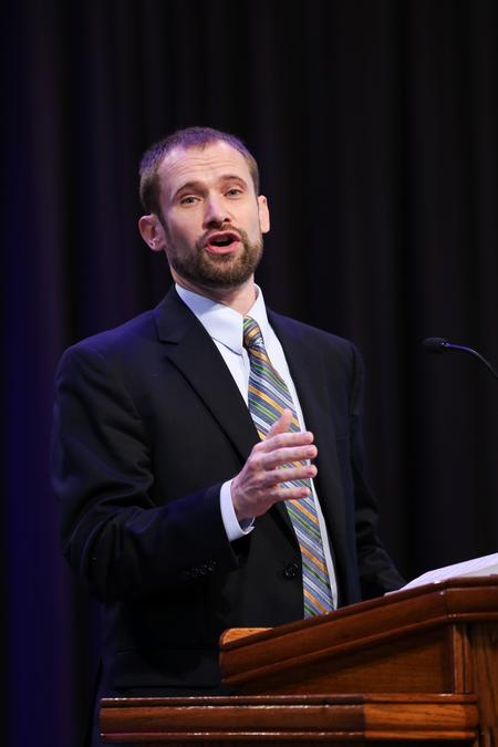 Dan Musselman, associate professor of music and acting chair, leads music in chapel. - Photo by Kristi McMurry Woody