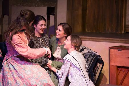 The four March sisters share a moment in the musical production of Little Women.  - Photo by Kristi McMurry Woody