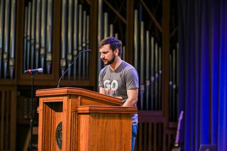 Joey Bakeer, senior biology major, leads a prayer for the Tampa team during the GO Trip commissioning service.  - Photo by Kristi McMurry Woody