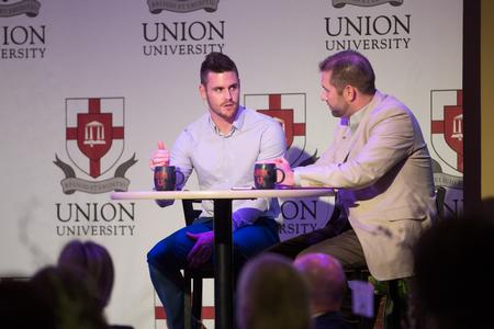 Tim Ellsworth (right), associate vice president for university communications, interviews David Boudia for the Q&A portion of the Union Auxiliary banquet. - Photo by Kristi McMurry Woody