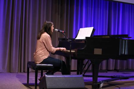Janelle Vest, junior communication studies major, plays piano and sings with the worship team leading chapel. - Photo by Kristi McMurry Woody