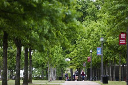 Students walk along the Great Lawn during a class change.  - Photo by Kristi McMurry Woody
