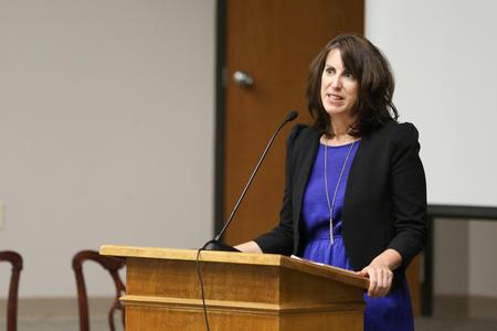 Chris Bailey, associate professor of English and director of composition support, presents a reading from her book "The Broken One." - Photo by Kristi McMurry Woody