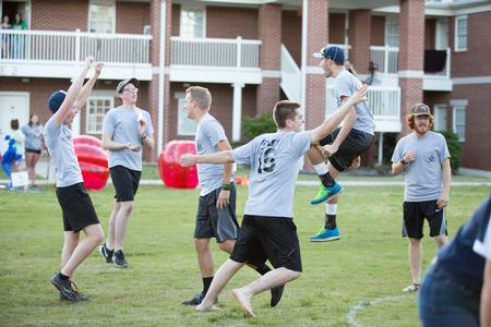 The men of Grey celebrate after winning the Union Cup at Field Day. - Photo by Kristi McMurry Woody