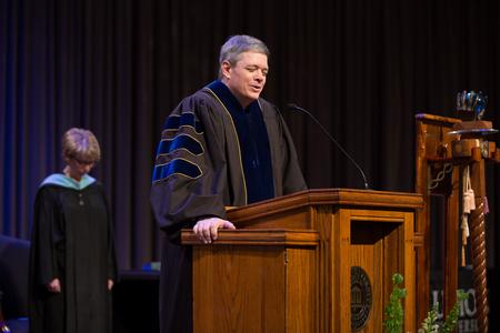 Web Drake, associate professor of communication arts, opens Awards Day chapel in prayer.  - Photo by Kristi McMurry Woody