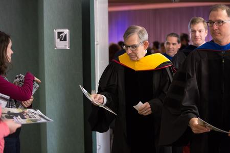 David Ward, professor of physics, picks up the newest issue of Cardinal & Cream after Awards Day chapel. - Photo by Kristi McMurry Woody