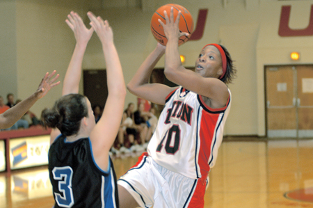 Sophomore Ena Daniels, pre-professional
studies biology major,shoots over Oklahoma City University’s Miranda Cornelius. Daniels's 12 points helped Union secure a 92-70 win and gave her double-digits in every Rotary Classic game. - Photo by Jonathan Blair