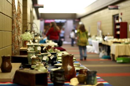 Pottery made by art students lines the hallway of the SUB during the annual Mother's Day Pottery Sale.  - Photo by Riley Boggs