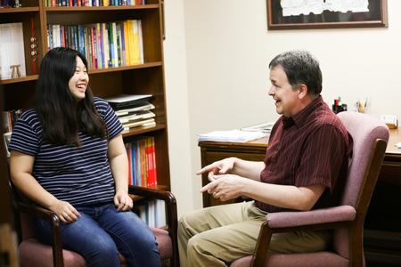 Ashley Moon, junior mathematics major, meets with Matt Lunsford, professor of mathematics. - Photo by Kristi McMurry Woody