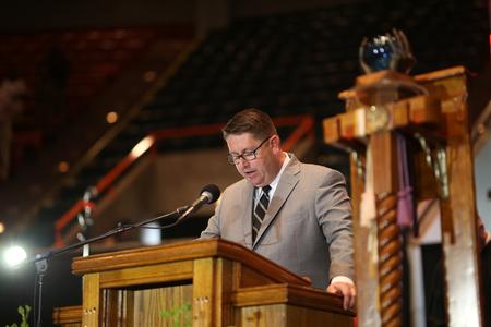 Keith Draper, church mobilizer for World Relief and missionary consultant for ScatterUs, opens spring commencement in prayer.  - Photo by Kristi McMurry Woody
