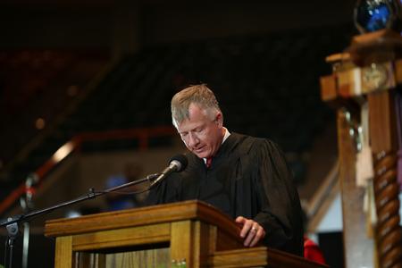 Rod Parker, chair of institutional advancement committee on the board of trustees, gives the benediction at the conclusion of spring commencement.  - Photo by Kristi McMurry Woody
