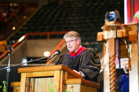 David Green, pastor of First Baptist Church in Greenville, Tenn, reads from Isaiah at the beginning of undergraduate spring commencement.  - Photo by Kristi McMurry Woody