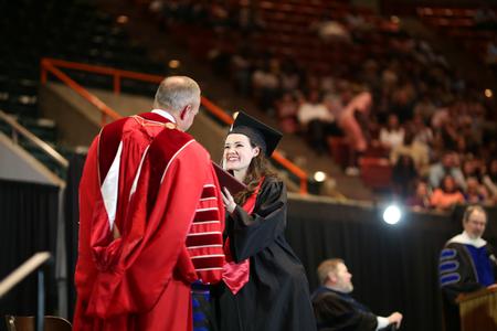 Mary Scarlett Greenway, art graduate, receives her diploma at spring commencement.  - Photo by Kristi McMurry Woody