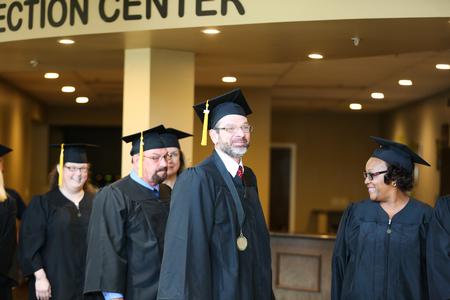 Graduates line up outside the West Jackson Baptist Church sanctuary in preparation for summer commencement.  - Photo by Kristi McMurry Woody