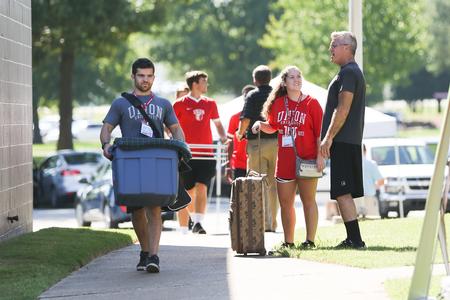 Faculty, staff and upperclassmen help out on new student move-in day.  - Photo by Kristi McMurry Woody