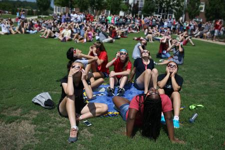 New students gather on the Great Lawn to view the solar eclipse.  - Photo by Kristi McMurry Woody