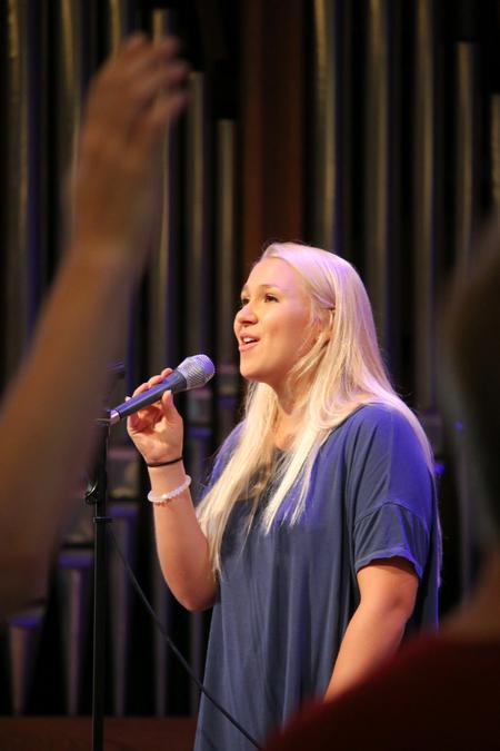 Lydia Shoemaker, sophomore music major, sings in chapel. - Photo by Hannah Heckart