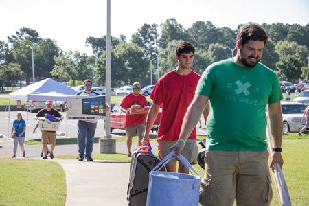 Students and parents help move new students in on Move-in Day. - Photo by Janelle Vest