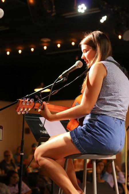 A student plays a song during Fall open mic in Barefoots Joe. - Photo by Hannah Heckart