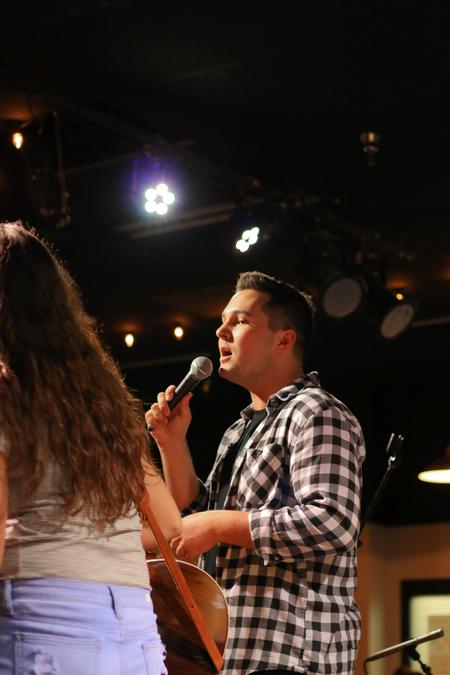 Sophomore Braxton Hobbs sings during Open Mic in Barefoots Joe. - Photo by Hannah Heckart