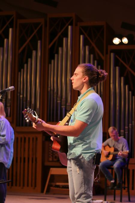 Tanner Cherry leads worship during chapel. - Photo by Hannah Heckart