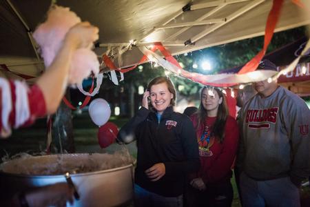 Students and their families enjoy cotton candy from the SAC booth during Union Night on the Great Lawn. - Photo by Kristi McMurry Woody