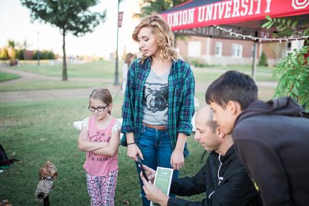 Biology students talk about their conservation efforts to guests of Union Night during Family Weekend.  - Photo by Kristi McMurry Woody