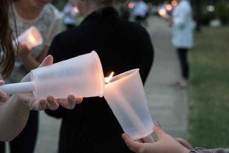 Candles are lit at the annual Remember Me Walk.  - Photo by Janelle Vest