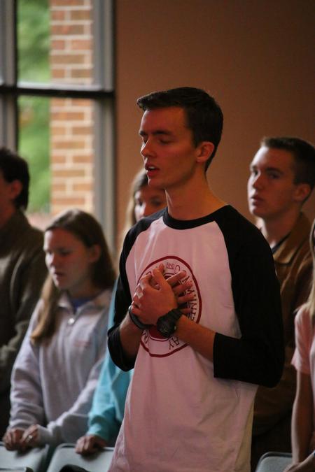 Daniel Regan worships during chapel. - Photo by Hannah Heckart