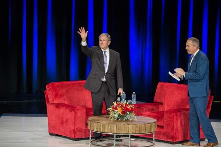 George W. Bush, 43rd president of the United States, waves as he walks on stage for the 20th annual Scholarship Banquet.  - Photo by Kristi McMurry Woody