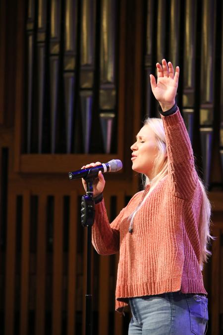 Lydia Shoemaker leads worship during chapel. - Photo by Hannah Heckart