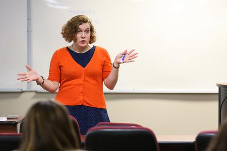 Janna Chance, associate professor of English, lectures on poetry. - Photo by Kristi McMurry Woody