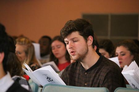 Ben Johnson sings during a special hymn sing chapel. - Photo by Hannah Heckart