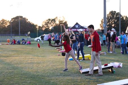 Students and guests of the university play a corn hole tournament during the Community Appreciation event hosted by Undergraduate Admissions.  - Photo by Kristi McMurry Woody