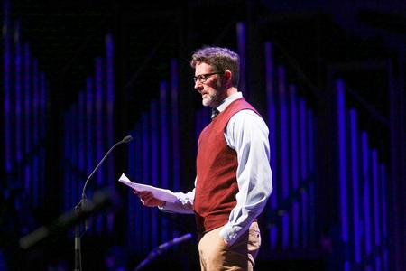 Michael Schiebout, associate professor of biology, reads scripture during Union Christmas. - Photo by Kristi McMurry Woody